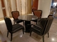 Table de salle à manger de tapisserie d'ameublement en cuir de Gelaimei et diamètre en verre de chaises 1 mètre